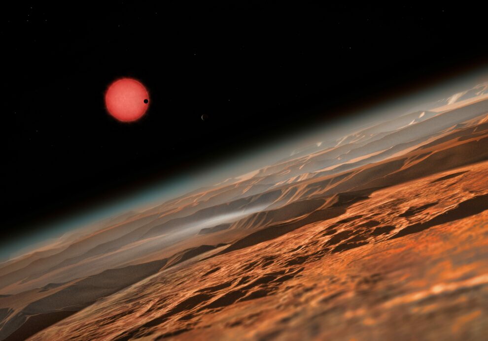 This_artist’s_impression_shows_an_imagined_view_from_close_to_one_of_the_three_planets_orbiting_an_ultracool_dwarf_star_just_40_light-years_from_Earth_that_were_discovered_using_the_TRAPPIST_telescope_at_ESO’s_La_Silla_Observatory._These_worlds_have_sizes