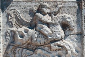 Theodoric_the_Great_on_horseback,_by_Nicholaus_(active_ca_1106–1140),_high-relief,_decorative_cycle_to_the_right_of_the_portal,_Basilica_of_San_Zeno,_Verona_(UNESCO_World_Heritage_List,_2000),_Veneto._Italy,_12th_century.