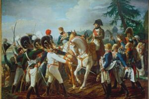 _Krieg_Österreichs_gegen_Frankreich_1809:_Ansprache_Napoleons_an_die_verbündeten_bayrischen_und_württembergischen_Truppen_am_Morgen_vor_der_Schlacht_von_Abensberg,_Niederbayern,_am_20._April_1809,_in_der_Napoleon_die_Österreicher_unter_Erzherzog_Karl_und_General_Hiller_schlägt).__Gemälde,_1819,_von_Jean-Baptiste_Debret_(1768-1848).__Öl_auf_Leinwand,_268_x_494_cm.__MV_1561._Versailles,_Château_et_Trianons.