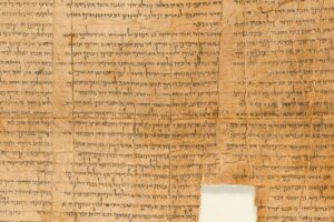 _Judaism._Dead_Sea_Scrolls:_Discovered_in_1947_in_the_Qumran_Caves,_in_the_Judaean_Desert_of_the_West_Bank.__Part_of_the_Isaiah_Scroll,_the_Longest_and_Oldest_(C._100_BC).